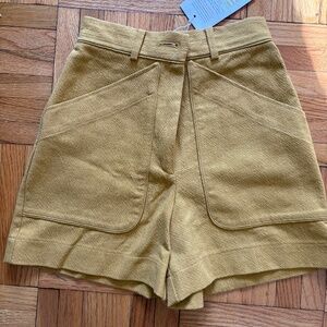 Neer worn. Areberello ochre shorts by Sézane